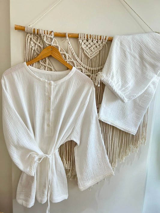 A vintage cream-colored outfit with a simple collar design.