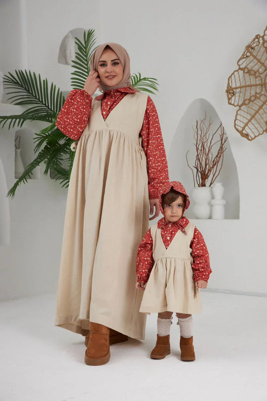 A flowy, knee-length dress with floral patterns and adjustable straps.