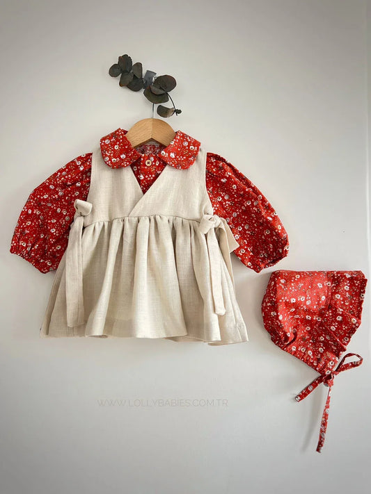 A flowy, knee-length dress with a floral pattern and adjustable spaghetti straps.