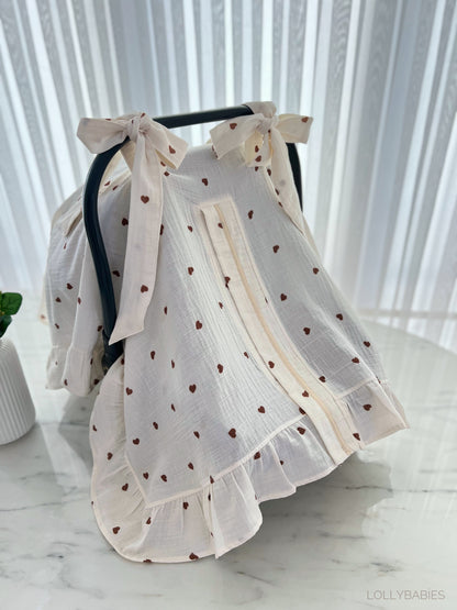 Puset örtüsü with a floral pattern in soft pastel colors for stroller protection.